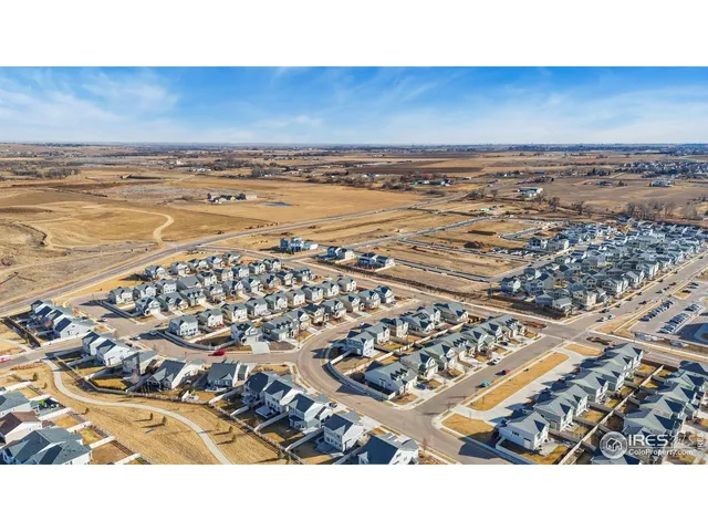 an aerial view of residential building and ocean