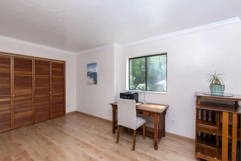 a view of a livingroom with furniture and staircase