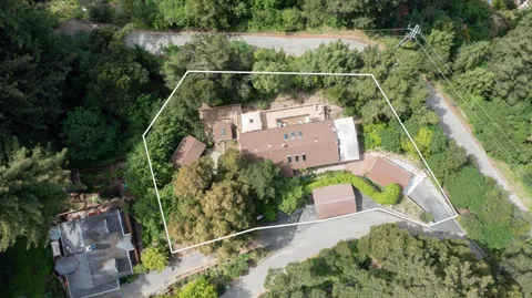 an aerial view of house with a yard