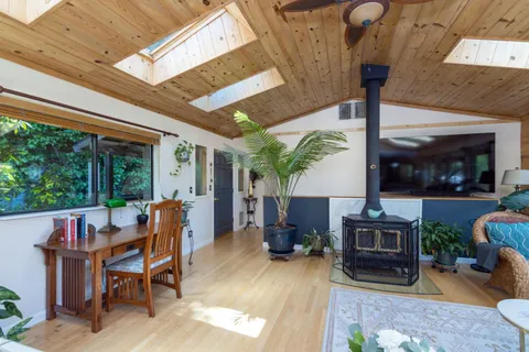 a view of an outdoor dining space with a table and chairs