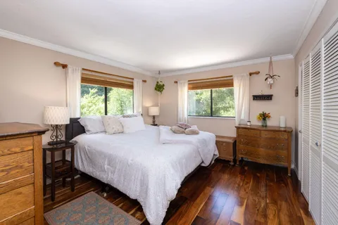 a bed room with a bed and a window