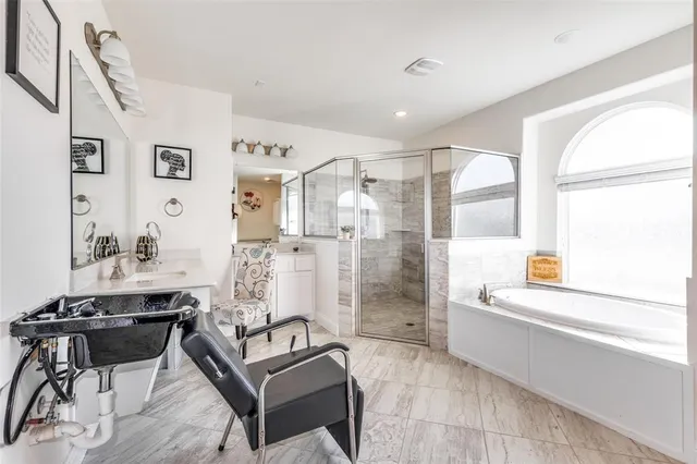 a living room with furniture and a ceiling fan