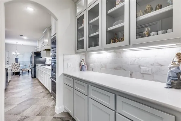 a living room with furniture a chandelier and a chandelier