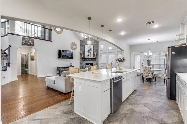 a living room with fireplace furniture and a flat screen tv