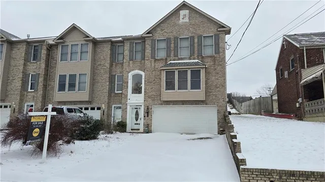 a kitchen with stainless steel appliances granite countertop a sink stove microwave and refrigerator