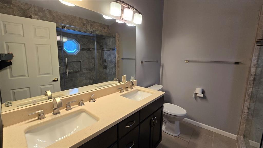 243 Augusta Street Pittsburgh, PA 15211 - Photo 18 of 43 a bathroom with a sink vanity granite and toilet