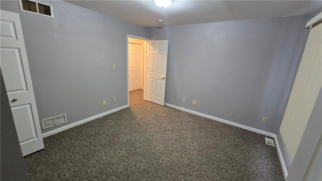 243 Augusta Street Pittsburgh, PA 15211 - Photo 31 of 43 an empty room with a window and a fireplace
