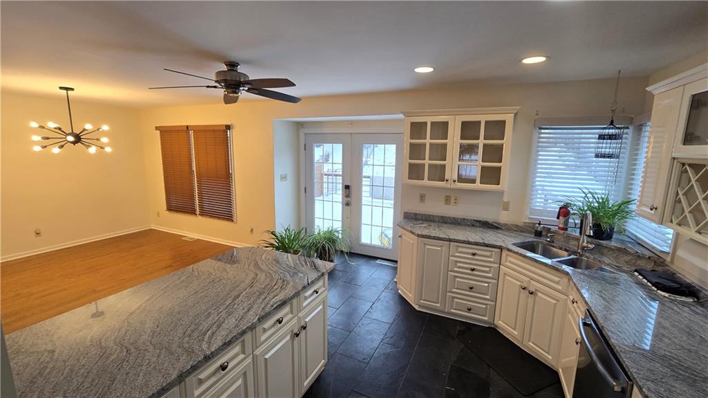 243 Augusta Street Pittsburgh, PA 15211 - Photo 5 of 43 a spacious bathroom with a granite countertop sink a large mirror and a shower