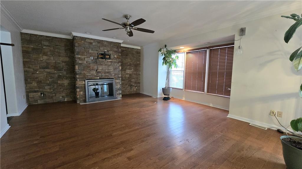 243 Augusta Street Pittsburgh, PA 15211 - Photo 7 of 43 wooden floor in an empty room with a fireplace