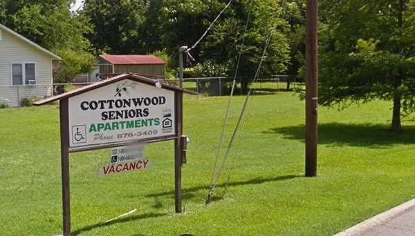 a sign on the side of the road