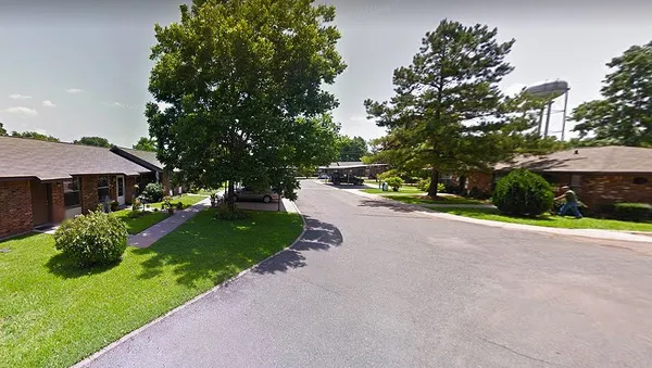 a view of a street with houses on both side