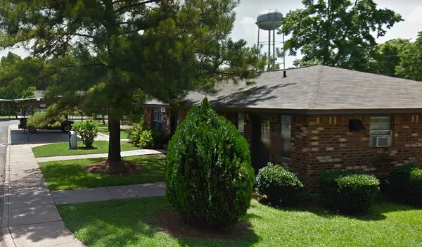 a view of a house with a garden
