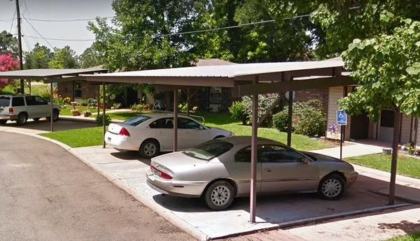 a view of a car parked in front of a house