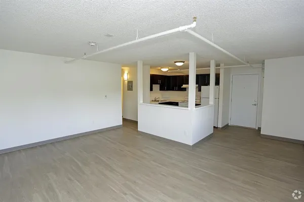a view of a kitchen with a sink and a microwave