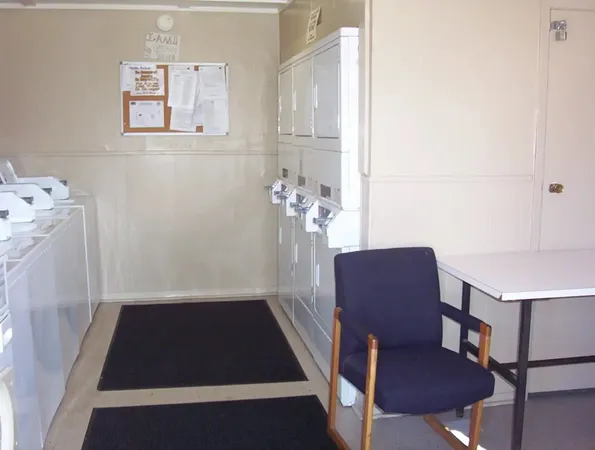 a view of a room with furniture and wooden floor