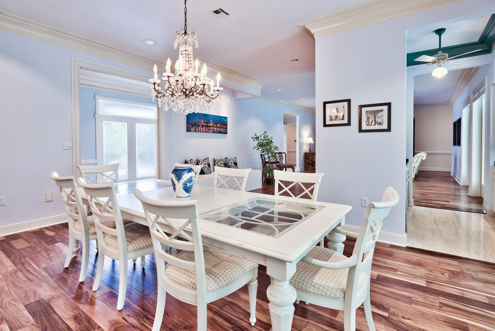 8 Weekewachee Circle Destin, FL 32541 - Photo 11 of 26 a view of a dining room with furniture wooden floor and chandelier
