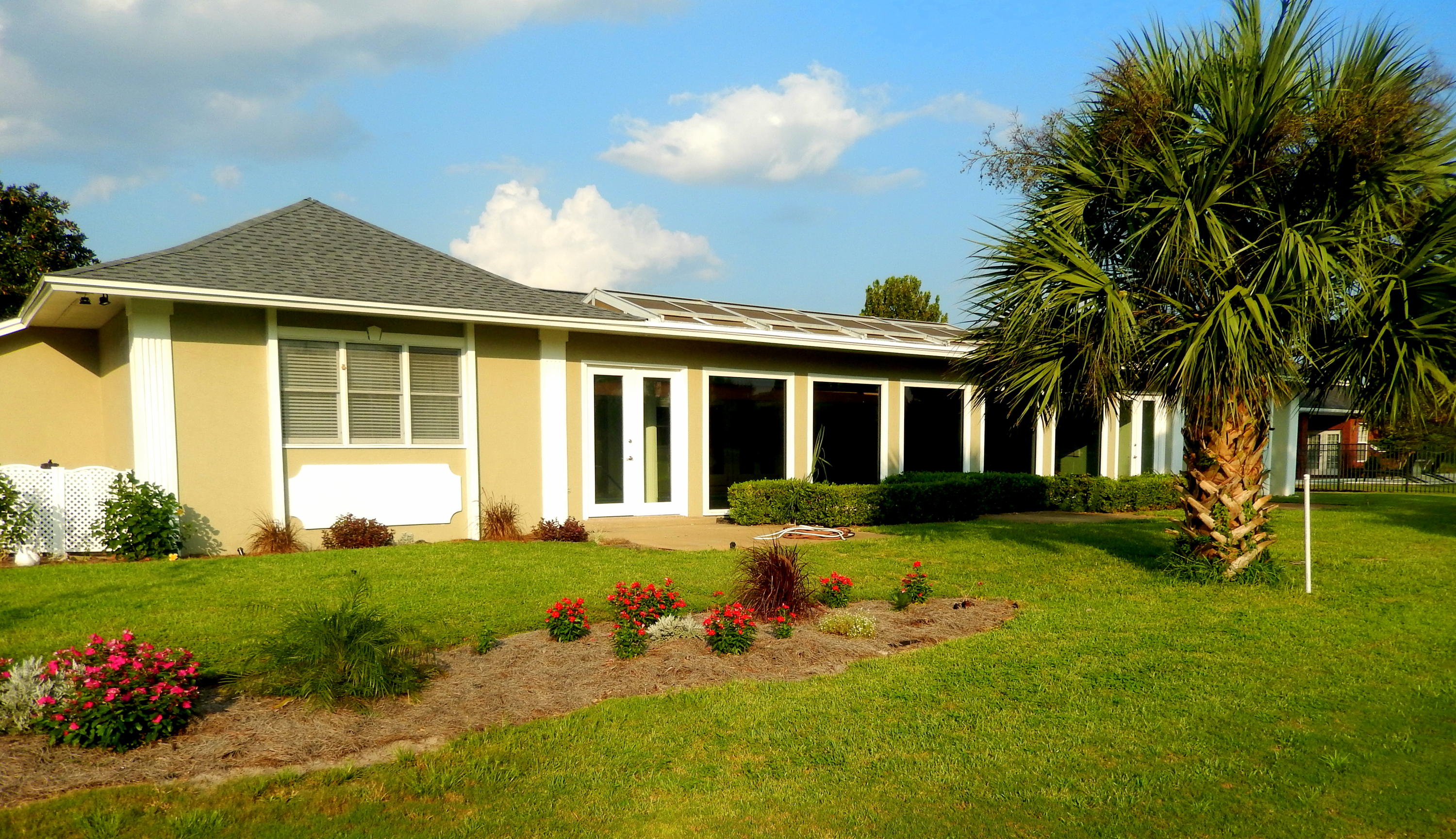 8 Weekewachee Circle Destin, FL 32541 - Photo 23 of 26 a front view of a house with a yard table and chairs