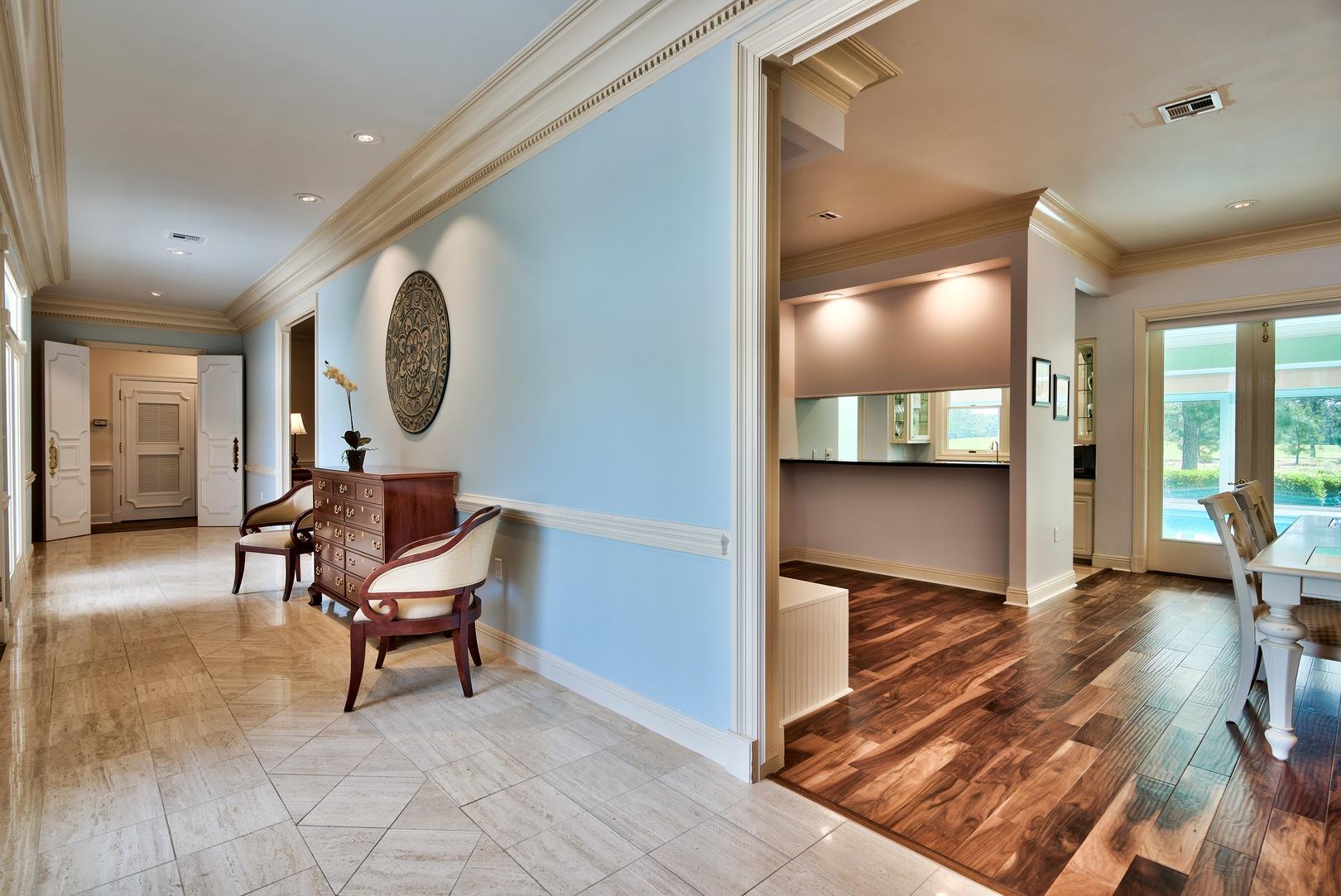 8 Weekewachee Circle Destin, FL 32541 - Photo 5 of 26 a view of a hallway with wooden floor and furniture