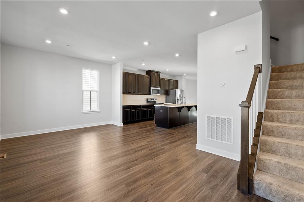 4108 Spruce Road Gibsonia, PA 15044 - Photo 14 of 45 a view of kitchen with microwave and wooden floor