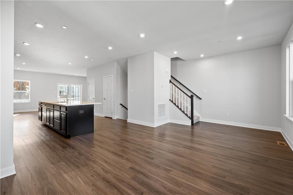 4108 Spruce Road Gibsonia, PA 15044 - Photo 14 of 46 a living room with hard wood floors furniture and kitchen view