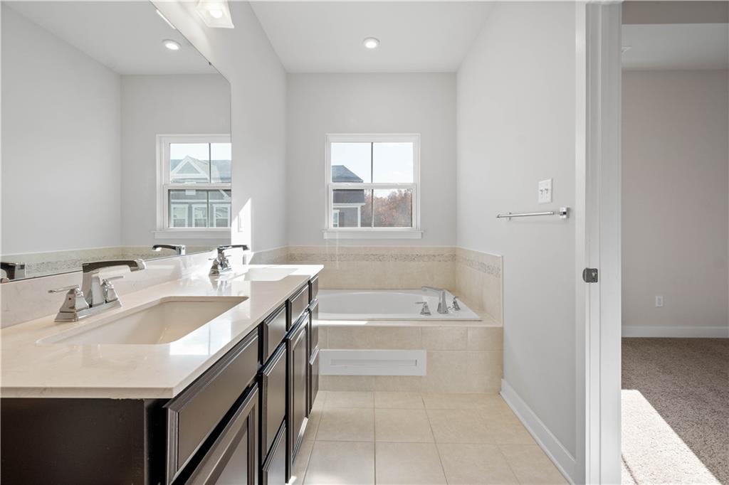 4108 Spruce Road Gibsonia, PA 15044 - Photo 22 of 45 a bathroom with a tub sink and mirror