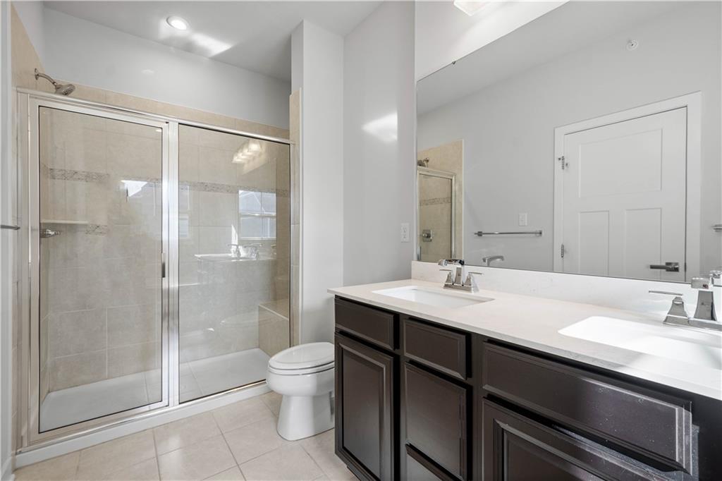 4108 Spruce Road Gibsonia, PA 15044 - Photo 23 of 45 a bathroom with a sink a toilet and shower