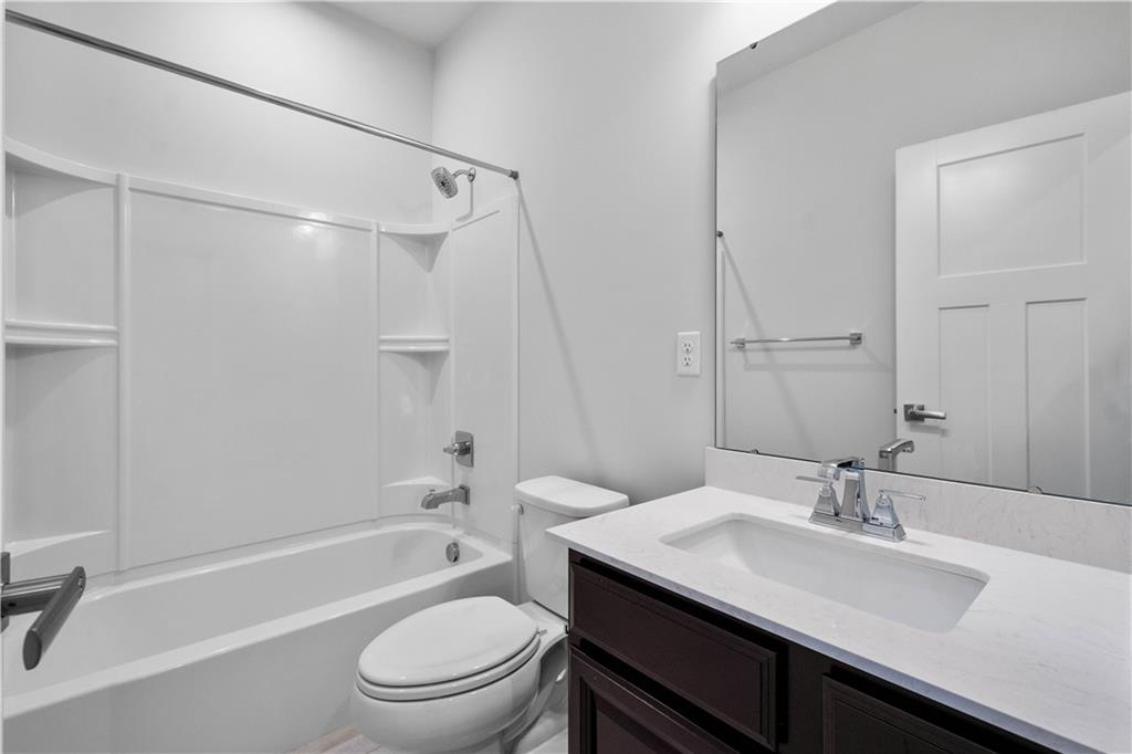 4108 Spruce Road Gibsonia, PA 15044 - Photo 28 of 45 a bathroom with a sink a toilet and a bathtub