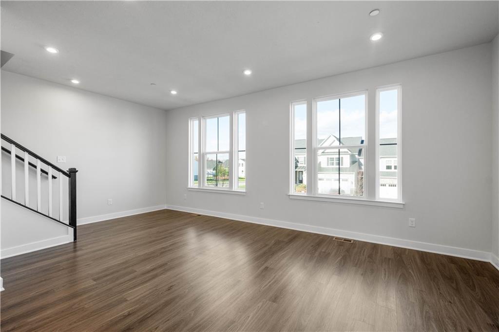 4108 Spruce Road Gibsonia, PA 15044 - Photo 7 of 45 an empty room with wooden floor and windows