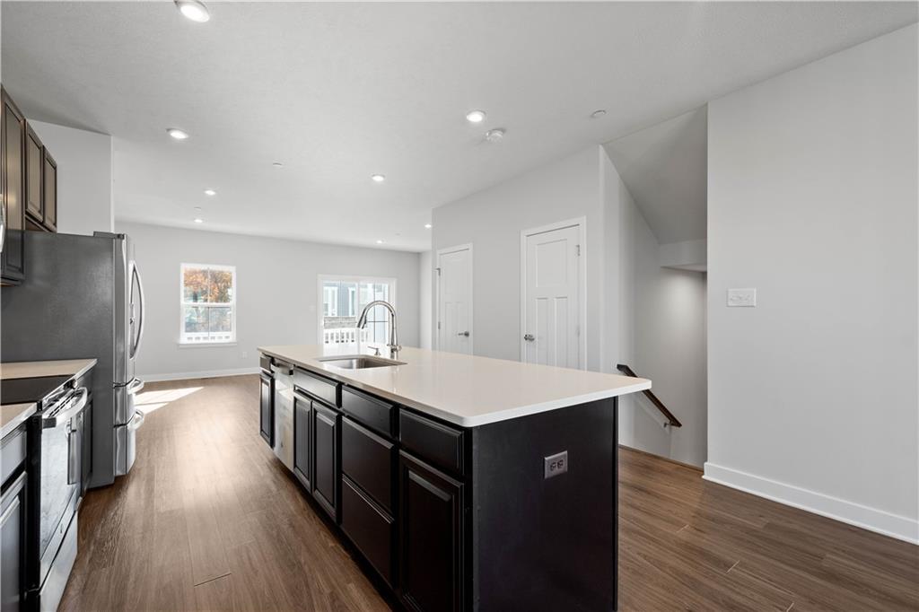 4108 Spruce Road Gibsonia, PA 15044 - Photo 10 of 45 a kitchen with a stove a sink and wooden floor
