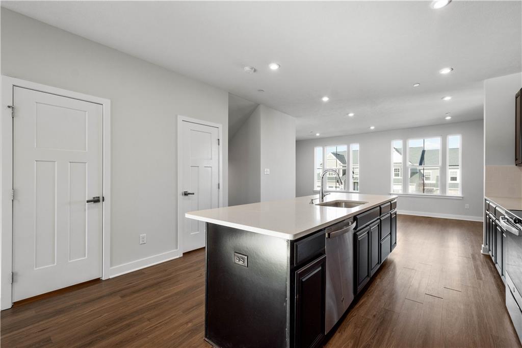 4108 Spruce Road Gibsonia, PA 15044 - Photo 10 of 46 a kitchen with kitchen island granite countertop a sink and wooden floor