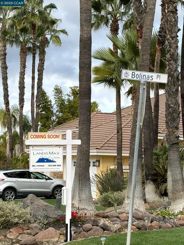 an aerial view of residential houses with outdoor space and swimming pool