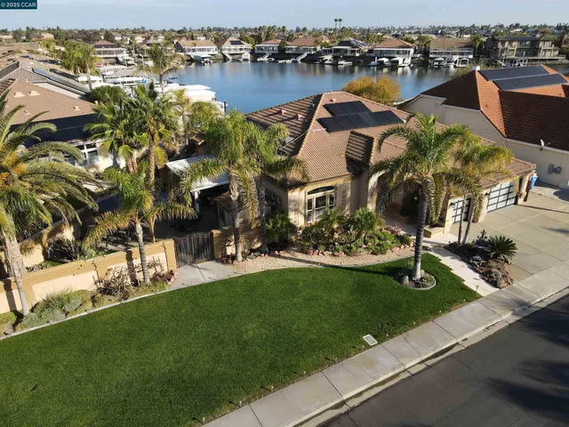an aerial view of a house with yard swimming pool and outdoor seating