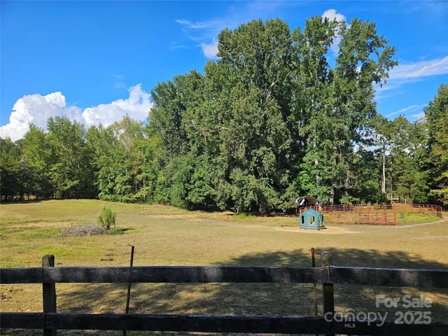 a view of a yard with an ocean view
