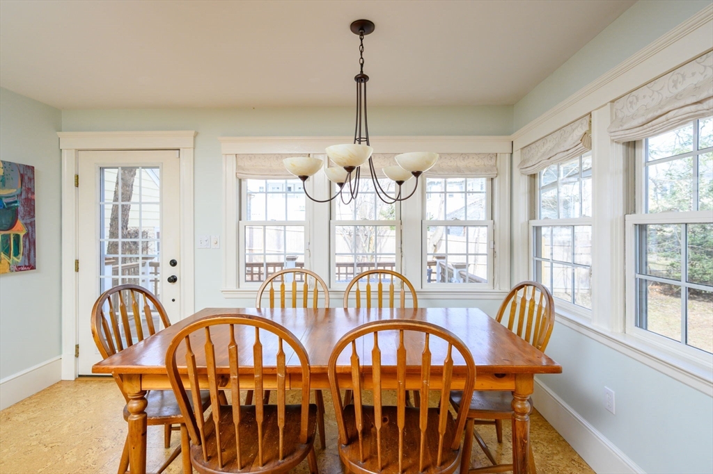 30 Ridge Road Milton, MA 02186 - Photo 11 of 33 a view of a dining room with furniture a chandelier and wooden floor
