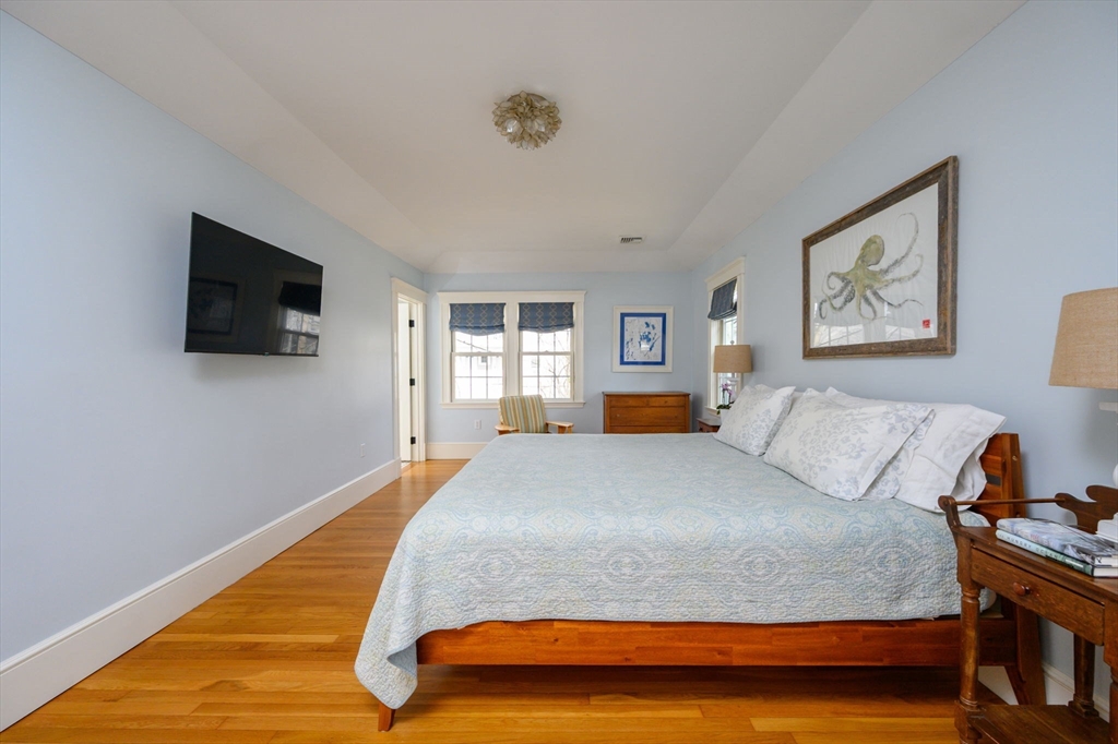 30 Ridge Road Milton, MA 02186 - Photo 19 of 33 a bedroom with a bed and a flat screen tv