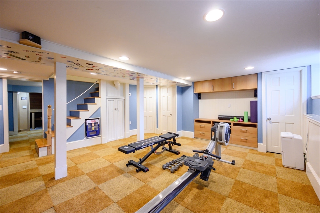 30 Ridge Road Milton, MA 02186 - Photo 25 of 33 a room with gym equipment and a table