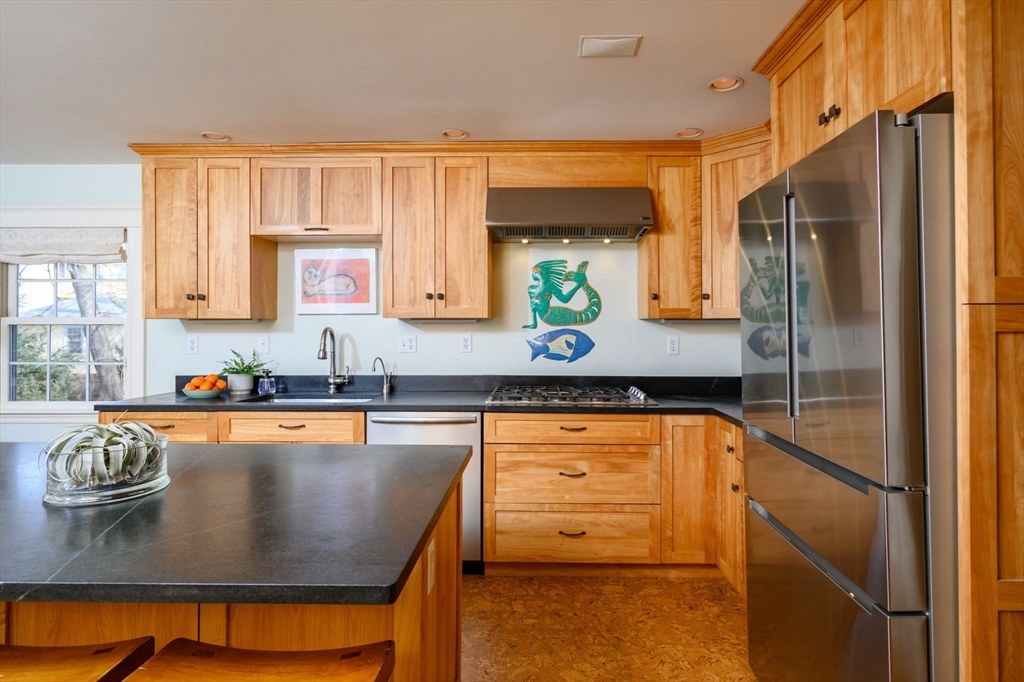 30 Ridge Road Milton, MA 02186 - Photo 8 of 33 a kitchen with stainless steel appliances granite countertop a sink a stove and a refrigerator