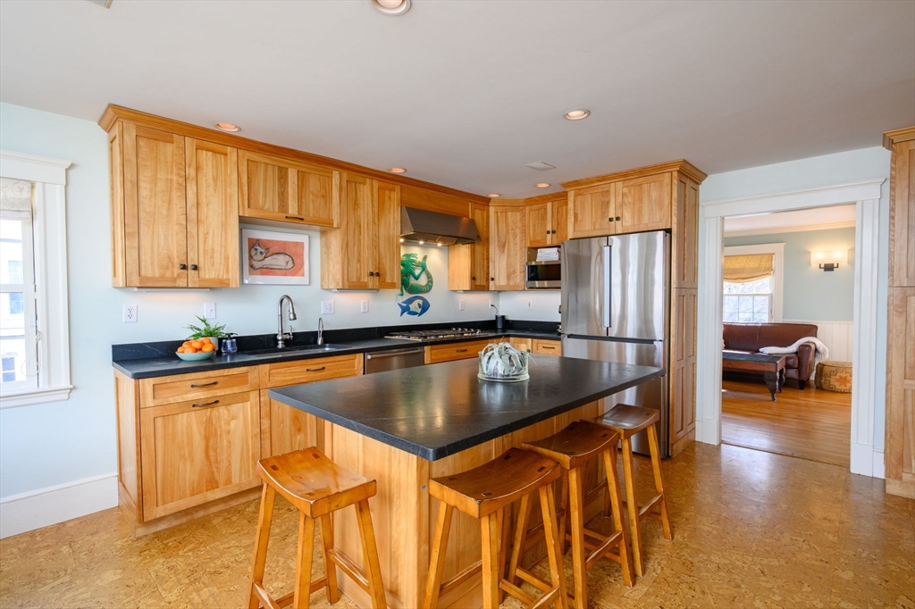 30 Ridge Road Milton, MA 02186 - Photo 10 of 33 a kitchen with stainless steel appliances granite countertop a refrigerator a sink and a stove