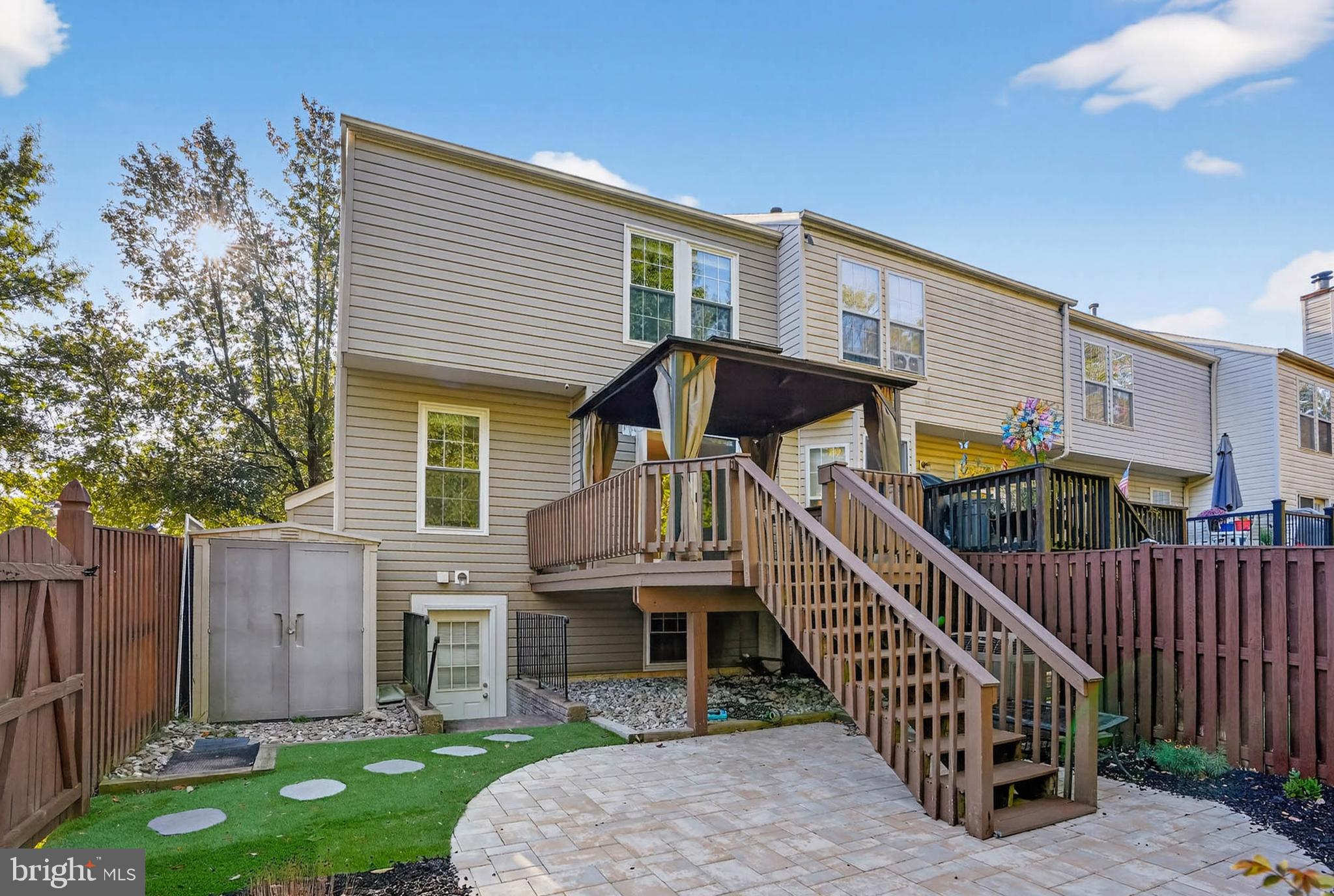 a view of a house with brick walls