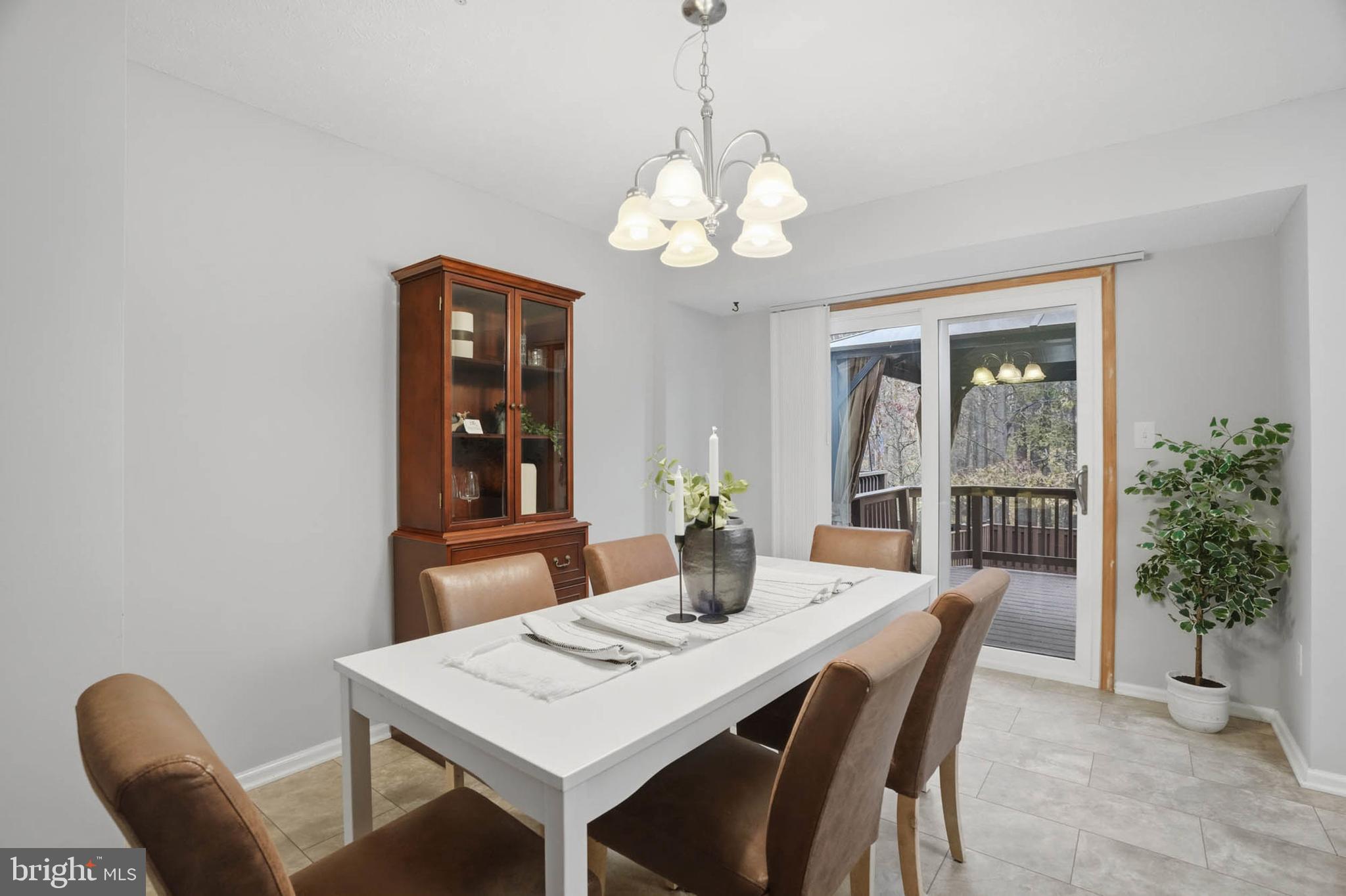 2512 Summers Ridge Drive Odenton, MD 21113 - Photo 14 of 37 a view of a dining room with a table and chairs