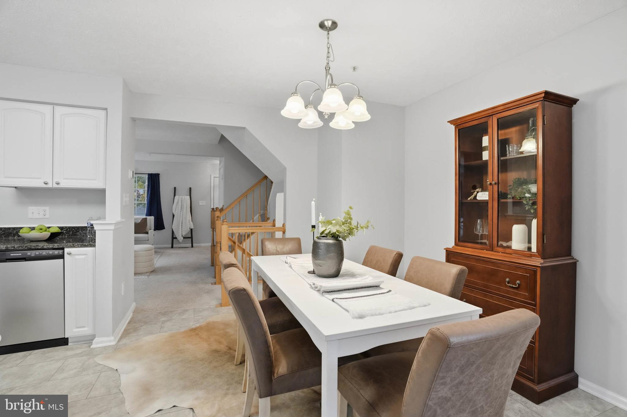 2512 Summers Ridge Drive Odenton, MD 21113 - Photo 14 of 37 a view of a dining room with furniture and chandelier