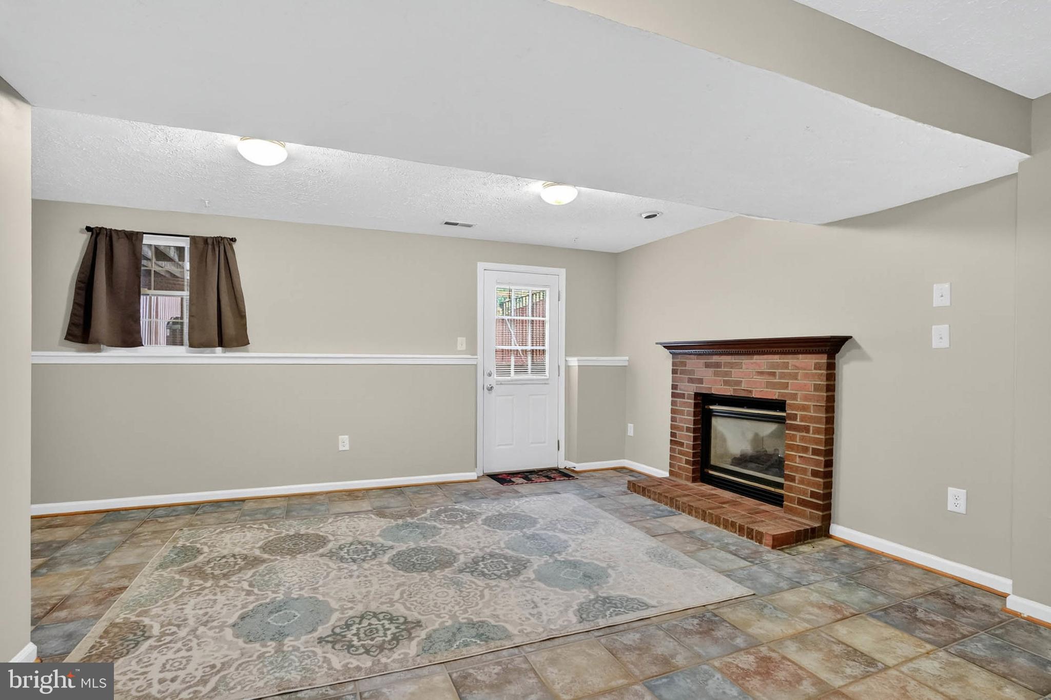 2512 Summers Ridge Drive Odenton, MD 21113 - Photo 27 of 37 a view of an empty room with window and fireplace