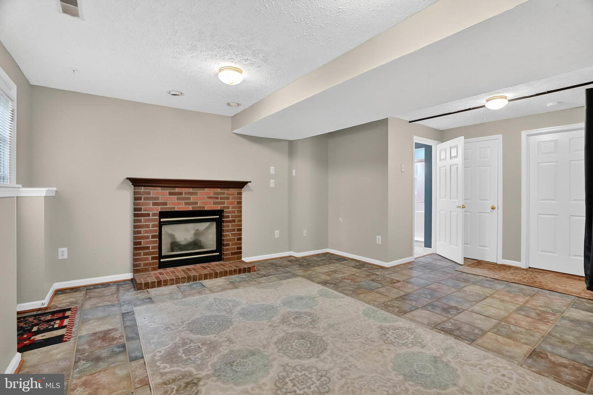 2512 Summers Ridge Drive Odenton, MD 21113 - Photo 31 of 37 a view of an empty room with fire place and a fireplace