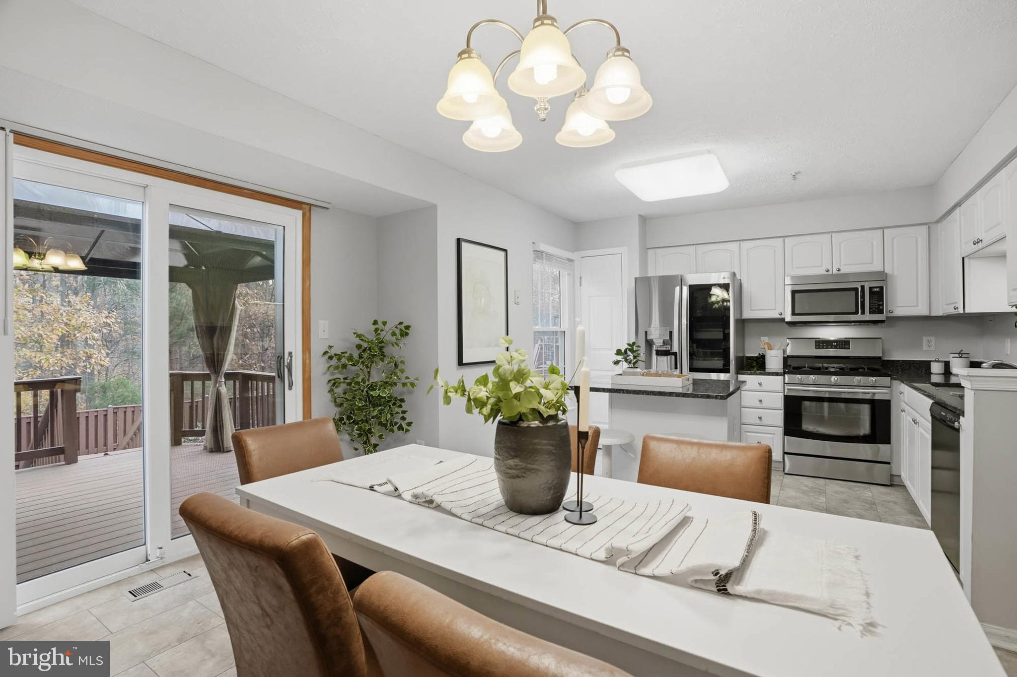 2512 Summers Ridge Drive Odenton, MD 21113 - Photo 9 of 37 a kitchen with a table and chairs in it