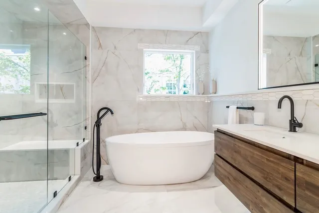 a bathroom with a double vanity sink and a bathtub