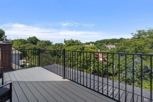 a view of a patio with couches table and chairs and potted plants