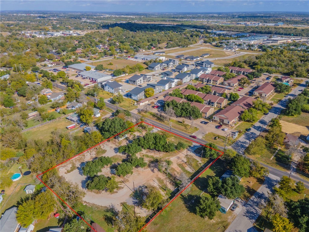 3105 East Villa Maria Road Bryan, TX 77803 - Photo 3 of 7 Aerial perspective of suburban area with property boundaries highlighted