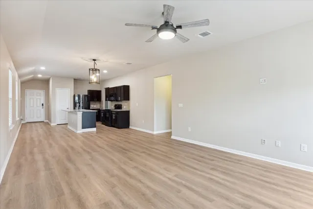 a view of a kitchen with a sink and a kitchen counter top