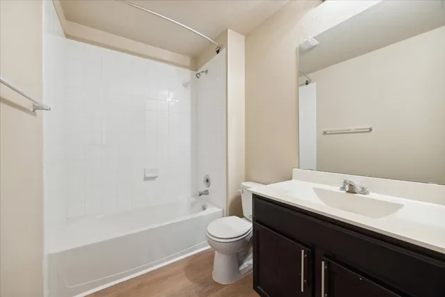 a bathroom with a sink a toilet and a bathtub
