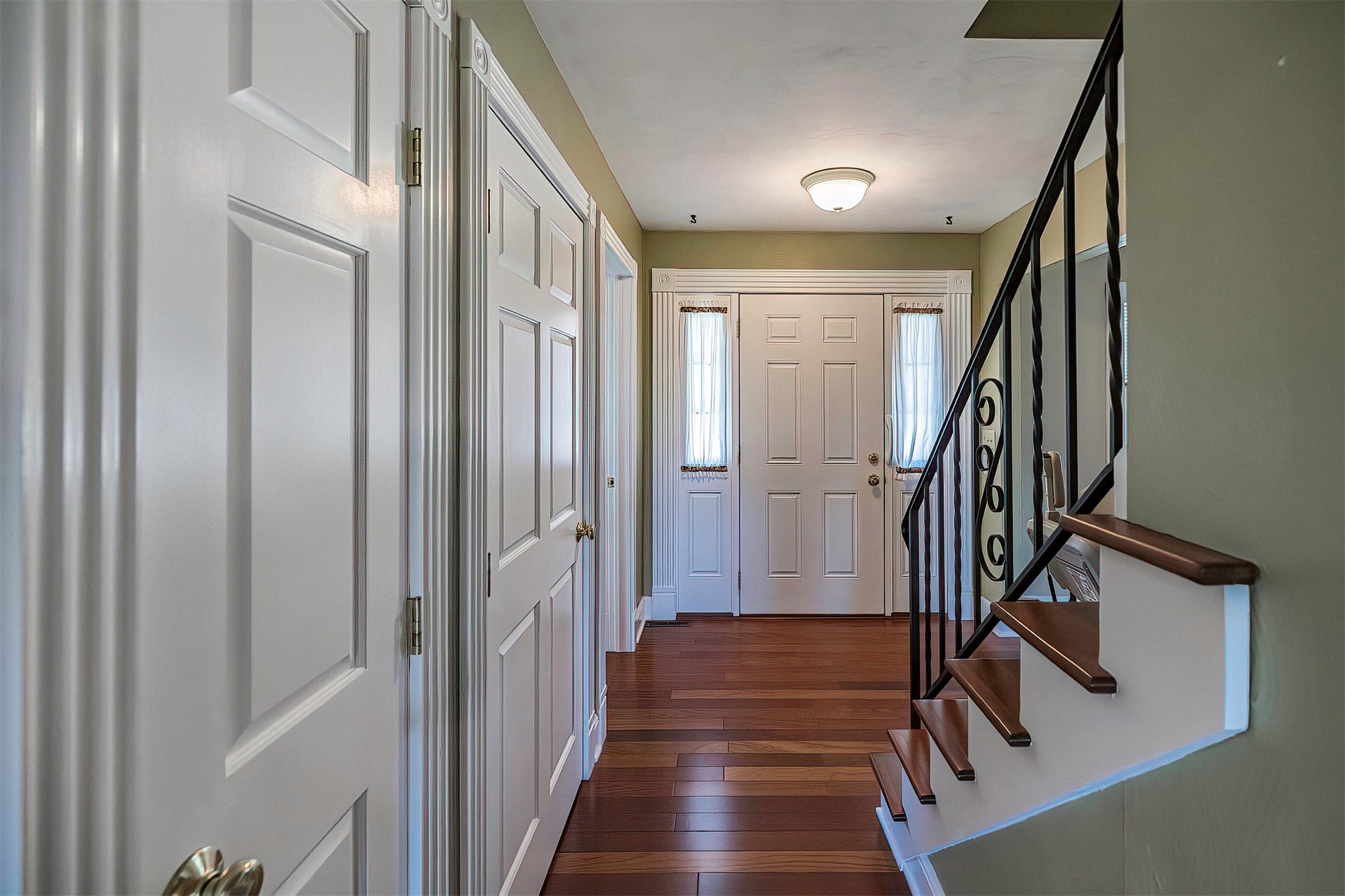 4232 Amherst Road Erie, PA 16506 - Photo 6 of 38 Foyer with cherry hardwood, white doors and trim.